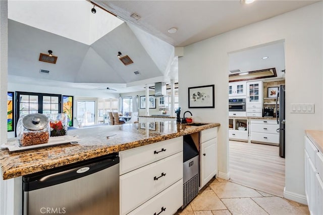 18016 Mariner Dr, Victorville, CA 92395 - kitchen featuring stainless steel appliances, a sink, white cabinets, light stone countertops, and recessed lighting