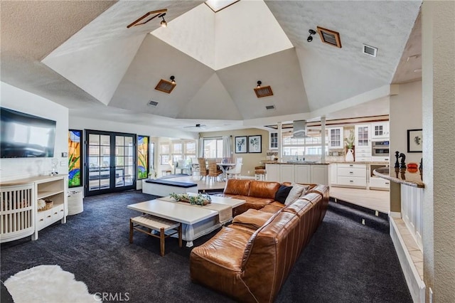 18016 Mariner Dr, Victorville, CA 92395 - carpeted living area with french doors, a sink, vaulted ceiling, and a textured ceiling