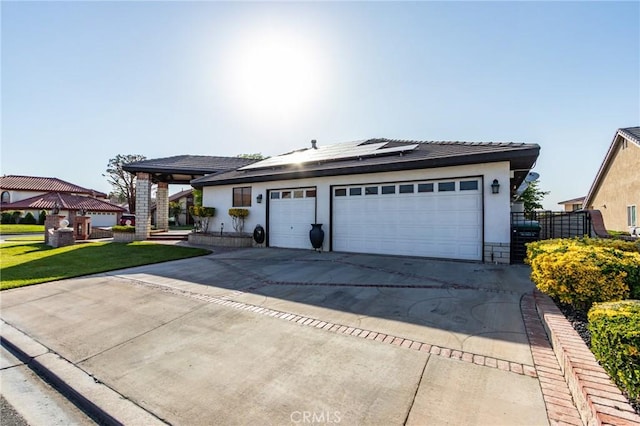 18016 Mariner Dr, Victorville, CA 92395 - ranch-style house featuring solar panels, a gazebo, concrete driveway, stucco siding, and a front lawn