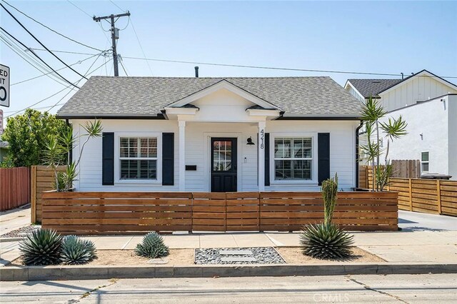 4218 E 3rd St, Long Beach, CA 90814 - view of front facade with a fenced front yard and roof with shingles