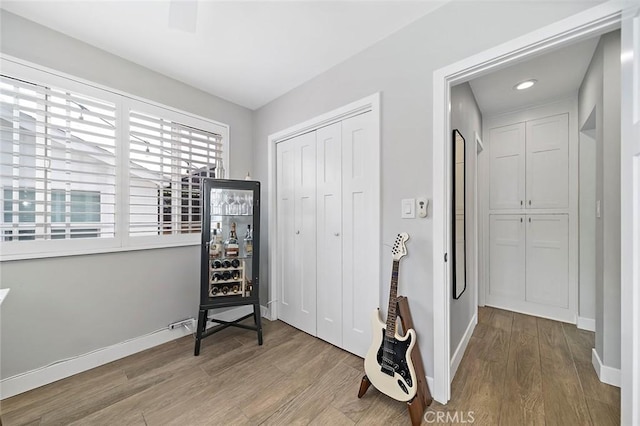 4218 E 3rd St, Long Beach, CA 90814 - bedroom featuring wood finished floors, a closet, and baseboards