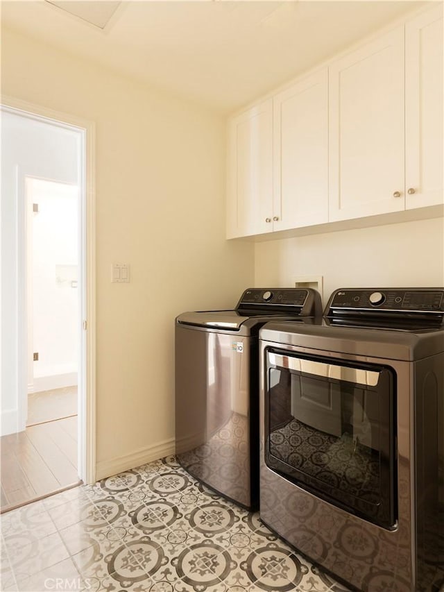 23317 Cuestport Dr, Valencia, CA 91354 - laundry area with washing machine and clothes dryer, cabinet space, and baseboards