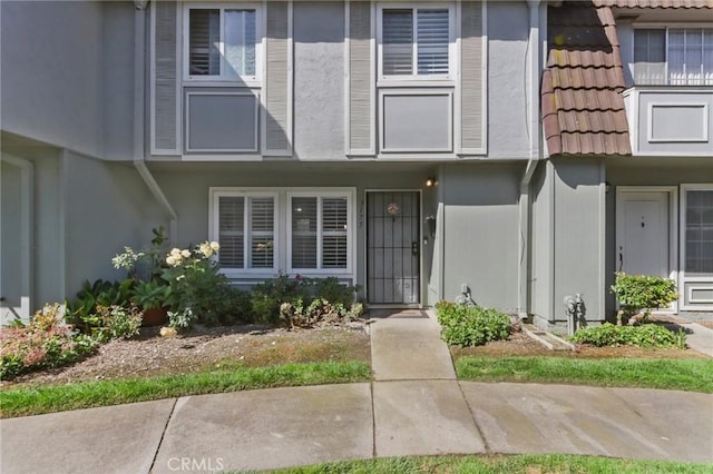 3175 Saginaw Ct, Pleasanton, CA 94588 - view of exterior entry featuring a tile roof and stucco siding