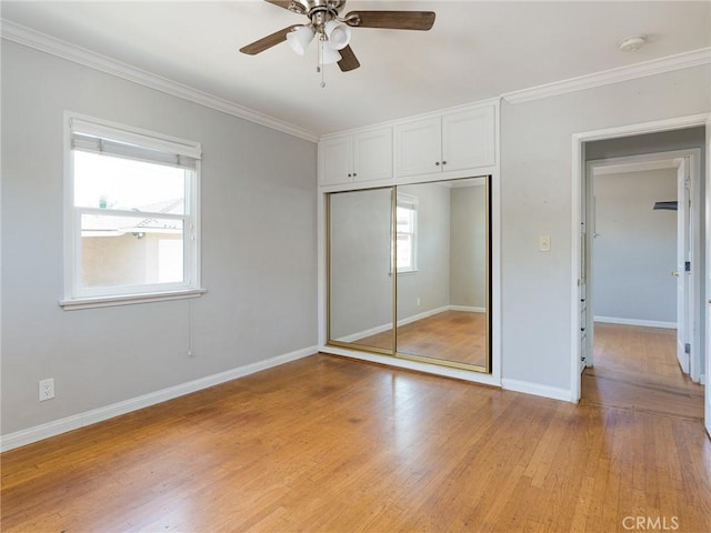 1032 W R St, Wilmington, CA 90744 - unfurnished bedroom with a closet, light wood finished floors, ornamental molding, baseboards, and a ceiling fan