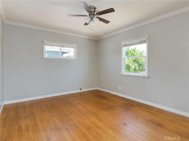 1032 W R St, Wilmington, CA 90744 - unfurnished room featuring healthy amount of natural light, baseboards, light wood finished floors, and crown molding