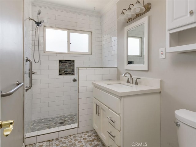 1032 W R St, Wilmington, CA 90744 - bathroom featuring toilet, vanity, tiled shower, healthy amount of natural light, and ornamental molding