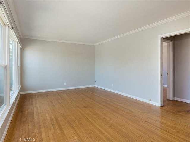 1032 W R St, Wilmington, CA 90744 - unfurnished room featuring crown molding, baseboards, and light wood-style floors