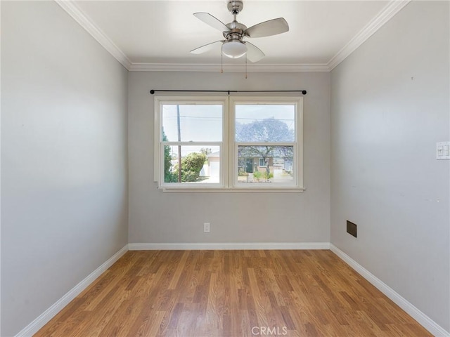 1032 W R St, Wilmington, CA 90744 - unfurnished room with wood finished floors, baseboards, ceiling fan, and crown molding