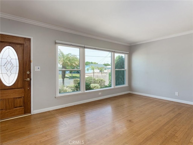 1032 W R St, Wilmington, CA 90744 - entryway featuring light wood-type flooring, baseboards, and ornamental molding