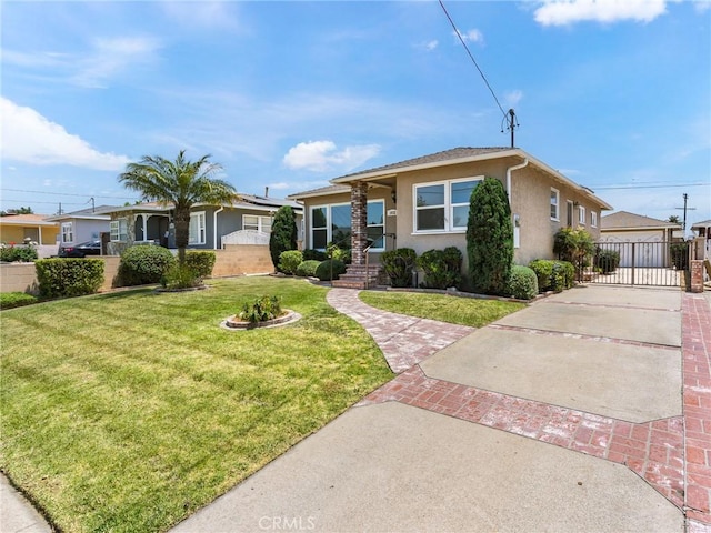 1032 W R St, Wilmington, CA 90744 - view of front of property featuring stucco siding, an outbuilding, and driveway
