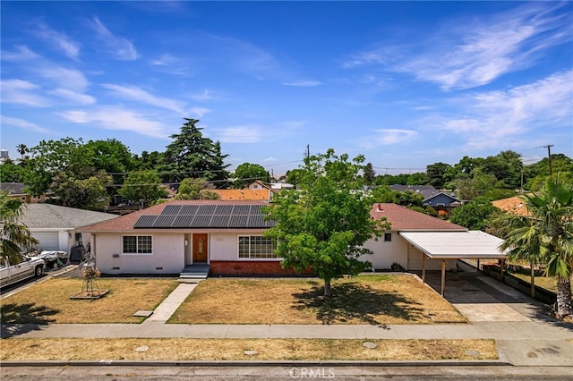 412 2nd St, Orland, CA 95963 - ranch-style house with concrete driveway, solar panels, an attached carport, and stucco siding