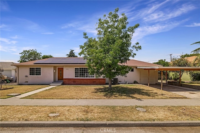 412 2nd St, Orland, CA 95963 - single story home with driveway, solar panels, a front yard, and stucco siding