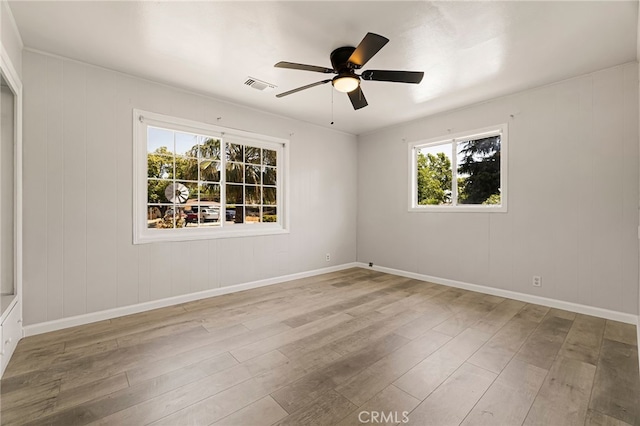 412 2nd St, Orland, CA 95963 - unfurnished room with healthy amount of natural light, wood finished floors, ceiling fan, and baseboards
