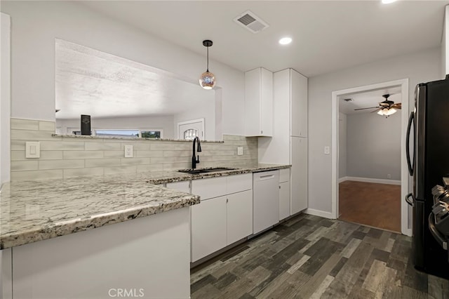 412 2nd St, Orland, CA 95963 - kitchen with a sink, dishwasher, white cabinets, backsplash, and dark wood-style flooring