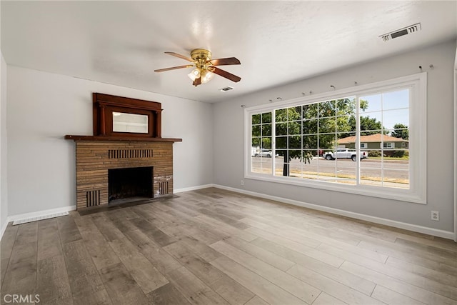 412 2nd St, Orland, CA 95963 - unfurnished living room with a ceiling fan, wood finished floors, baseboards, and a fireplace