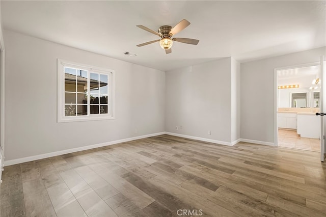 412 2nd St, Orland, CA 95963 - spare room featuring a ceiling fan, light wood-style flooring, and baseboards