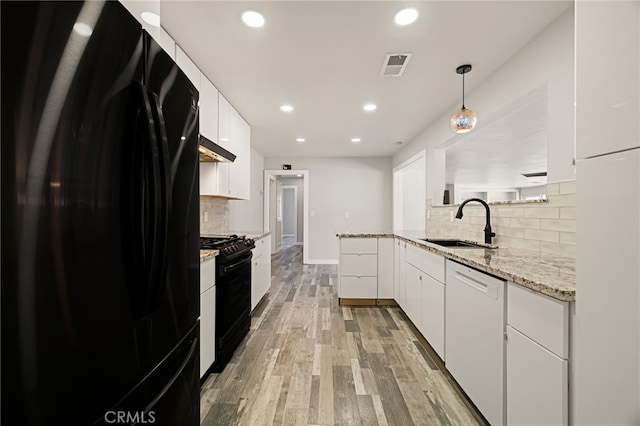 412 2nd St, Orland, CA 95963 - kitchen featuring black appliances, a sink, white cabinets, tasteful backsplash, and recessed lighting