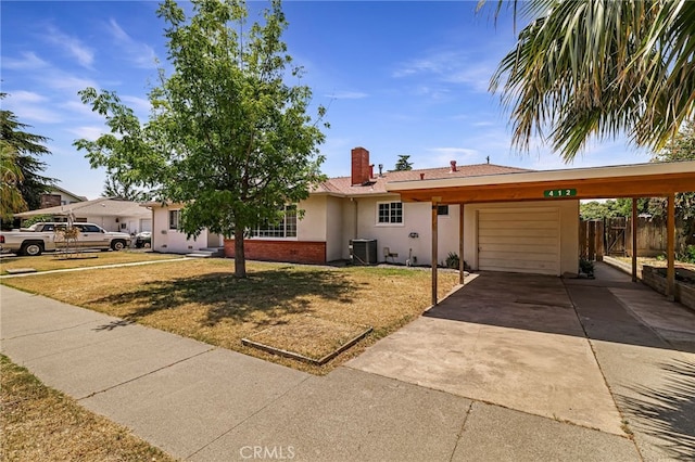 412 2nd St, Orland, CA 95963 - ranch-style house featuring an attached garage, central air condition unit, brick siding, a chimney, and stucco siding