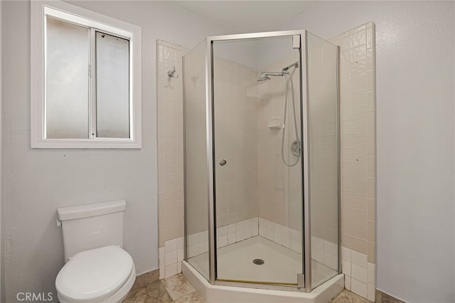 412 2nd St, Orland, CA 95963 - bathroom with a stall shower, toilet, and baseboards