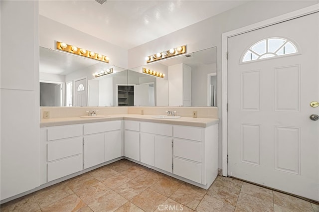 412 2nd St, Orland, CA 95963 - bathroom featuring double vanity and stone finish floors