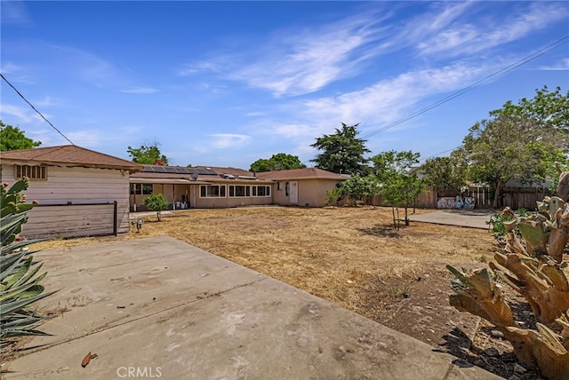 412 2nd St, Orland, CA 95963 - back of property with roof mounted solar panels and a patio