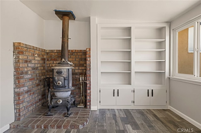412 2nd St, Orland, CA 95963 - detailed view of a wood stove, wood finished floors, and baseboards