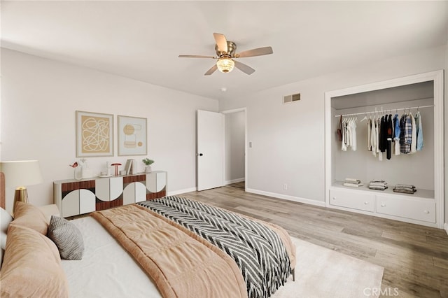412 2nd St, Orland, CA 95963 - bedroom with wood finished floors, baseboards, a closet, and a ceiling fan