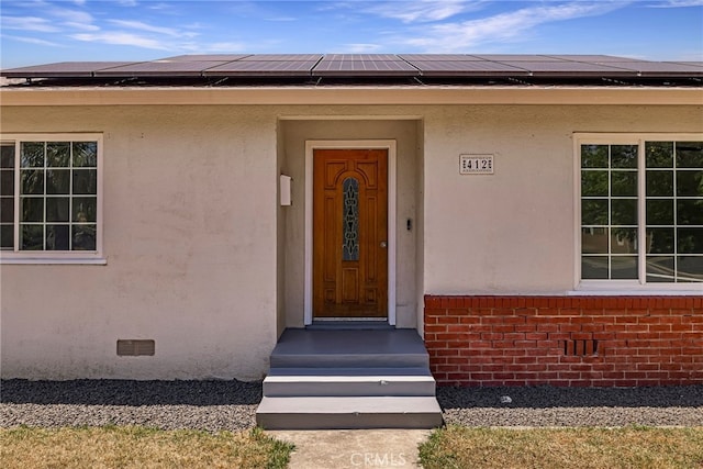 412 2nd St, Orland, CA 95963 - entrance to property with solar panels, stucco siding, crawl space, and brick siding