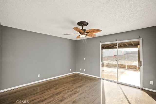 29247 Allan St, Lake Elsinore, CA 92532 - empty room with wood finished floors, a textured ceiling, a ceiling fan, and baseboards