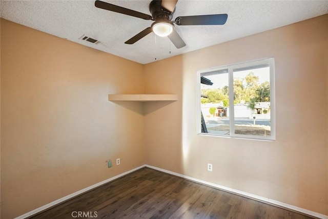 29247 Allan St, Lake Elsinore, CA 92532 - spare room featuring a ceiling fan, dark wood finished floors, and a textured ceiling