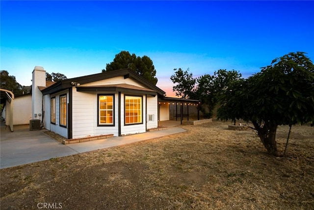 29247 Allan St, Lake Elsinore, CA 92532 - back of house featuring a chimney and a patio