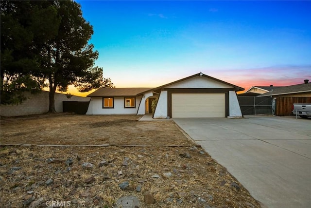 29247 Allan St, Lake Elsinore, CA 92532 - ranch-style house with concrete driveway, a garage, and stucco siding