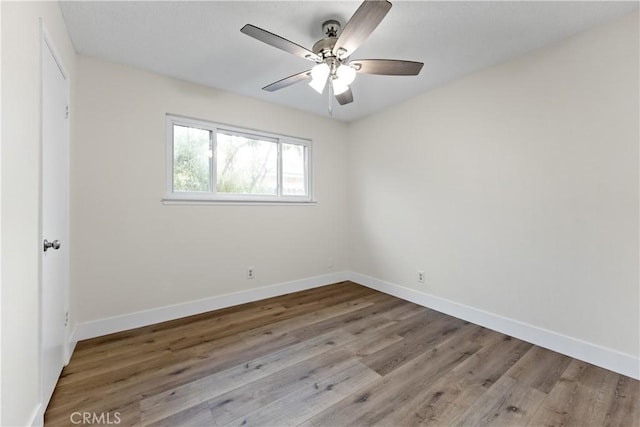 2131 W Pico Ave, Fresno, CA 93705 - spare room featuring wood finished floors, baseboards, and a ceiling fan