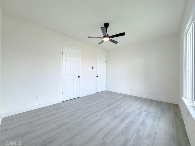 1512 S Butler Ave, Compton, CA 90221 - unfurnished bedroom featuring wood finished floors, baseboards, and a ceiling fan