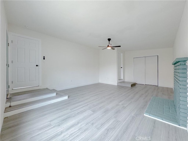 1512 S Butler Ave, Compton, CA 90221 - unfurnished living room featuring a ceiling fan, wood finished floors, and baseboards