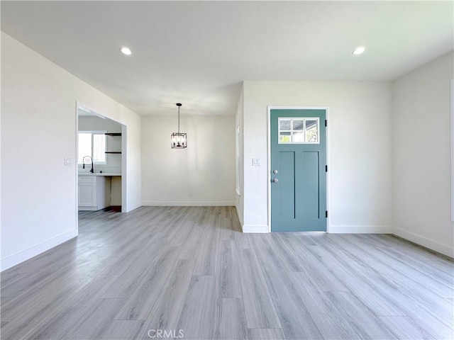 1512 S Butler Ave, Compton, CA 90221 - foyer entrance with a chandelier, light wood-style floors, recessed lighting, and baseboards