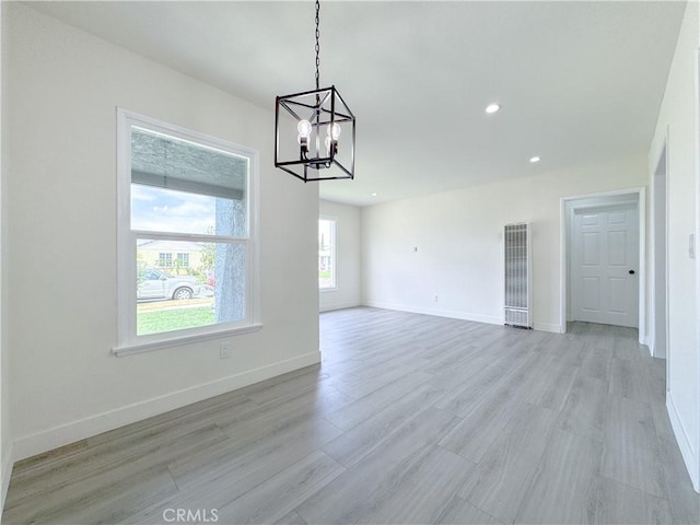 1512 S Butler Ave, Compton, CA 90221 - unfurnished dining area featuring a heating unit, a chandelier, light wood-style flooring, baseboards, and recessed lighting