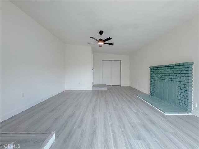 1512 S Butler Ave, Compton, CA 90221 - unfurnished living room featuring a ceiling fan, wood finished floors, baseboards, and a fireplace
