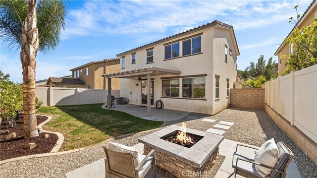 36434 Geranium Dr, Lake Elsinore, CA 92532 - rear view of house with an outdoor fire pit, stucco siding, a patio, and a pergola