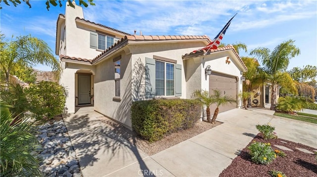 36434 Geranium Dr, Lake Elsinore, CA 92532 - view of front of property featuring driveway, stucco siding, an attached garage, a tile roof, and a chimney