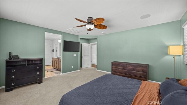 36434 Geranium Dr, Lake Elsinore, CA 92532 - bedroom with light colored carpet, baseboards, ensuite bath, and ceiling fan