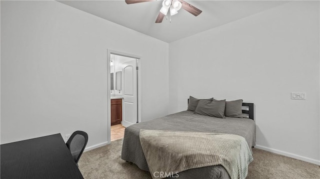 36434 Geranium Dr, Lake Elsinore, CA 92532 - bedroom featuring light colored carpet, baseboards, ensuite bath, and a ceiling fan