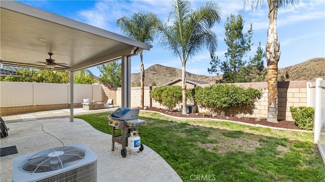 36434 Geranium Dr, Lake Elsinore, CA 92532 - view of yard featuring a ceiling fan, a patio, a mountain view, and central AC