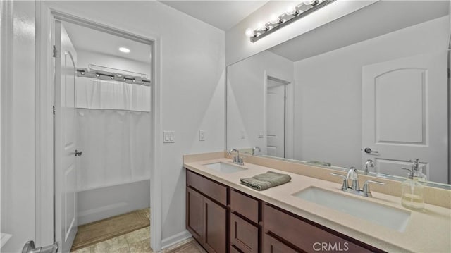 36434 Geranium Dr, Lake Elsinore, CA 92532 - bathroom featuring double vanity and shower / tub combo with curtain