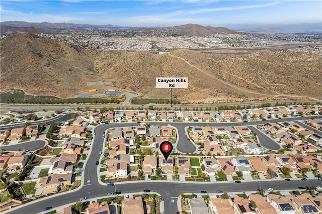 36434 Geranium Dr, Lake Elsinore, CA 92532 - aerial view of property and surrounding area with a mountain backdrop and nearby suburban area