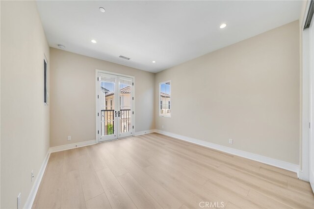 127 Toretta, Irvine, CA 92602 - spare room featuring light wood-style floors, baseboards, recessed lighting, and a smoke detector