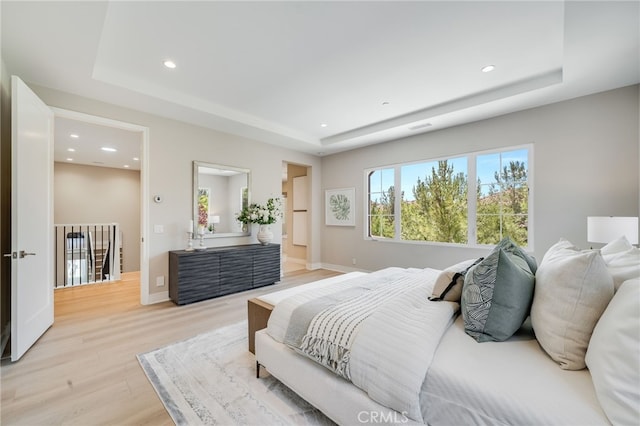 127 Toretta, Irvine, CA 92602 - bedroom with a raised ceiling, light wood-style floors, recessed lighting, and baseboards