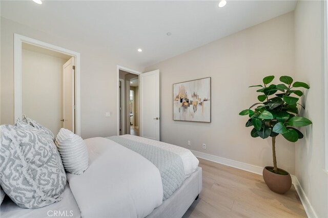 127 Toretta, Irvine, CA 92602 - bedroom featuring light wood-style flooring, recessed lighting, and baseboards