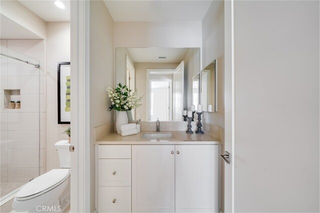 127 Toretta, Irvine, CA 92602 - bathroom with toilet, a stall shower, and vanity