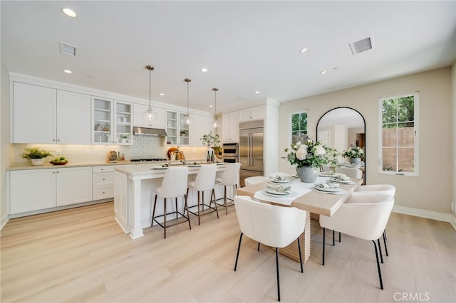 127 Toretta, Irvine, CA 92602 - dining area with light wood-type flooring, recessed lighting, and baseboards